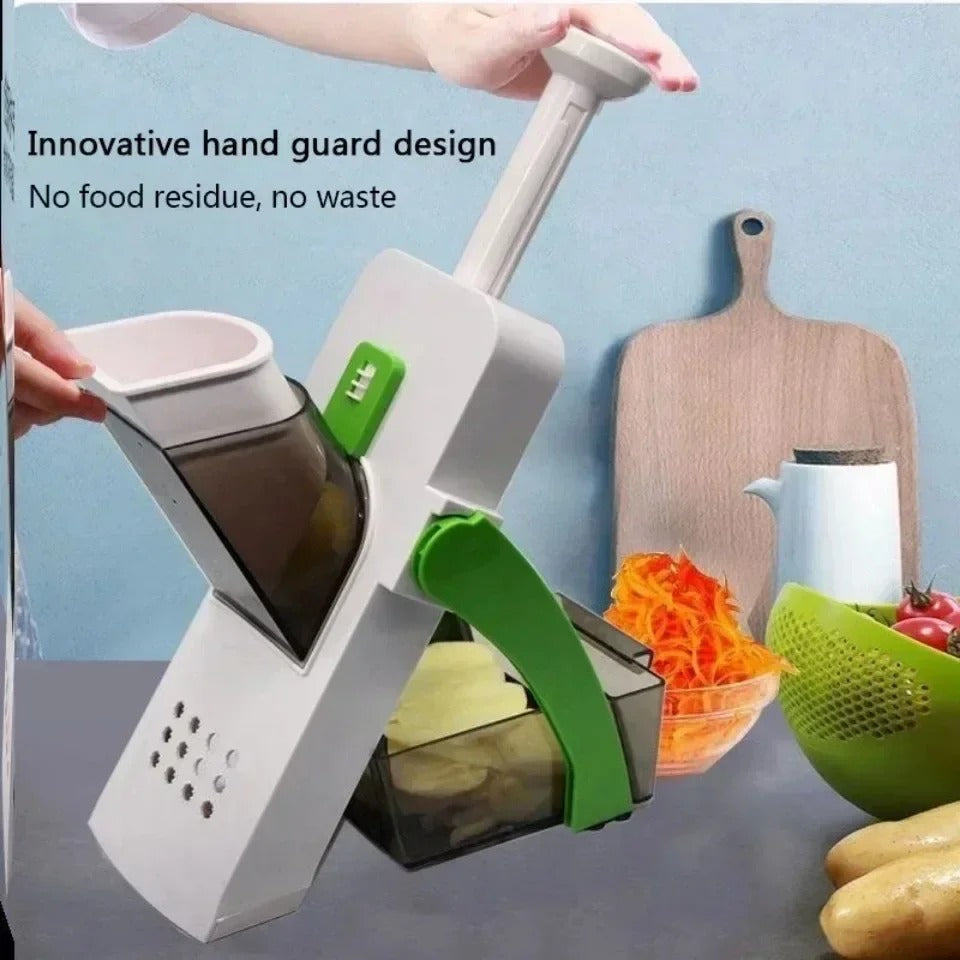 Vegetable cutter in use with the hand guard