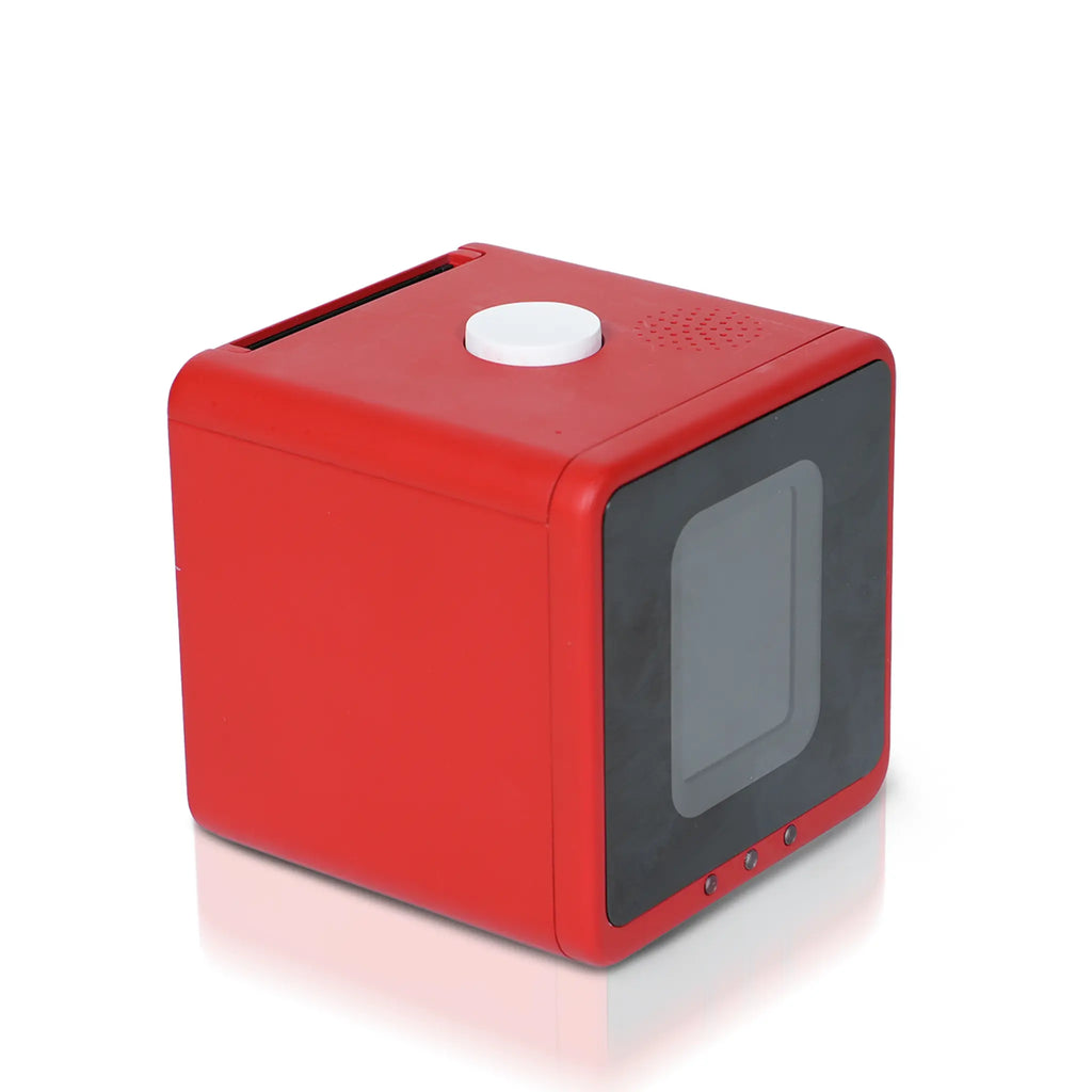 DreamCube inkless sticker printer in red, front three-quarter view